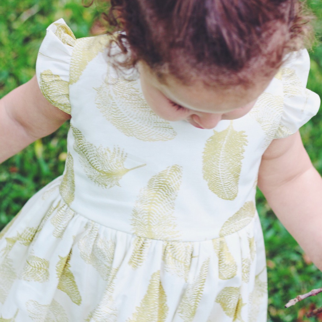 The white & gold feather 'Sierra' Dress from cuteheads' new line of modern dresses for toddlers and babies, only for the 2015 holiday season, the Cotton Candy Holiday Collection
