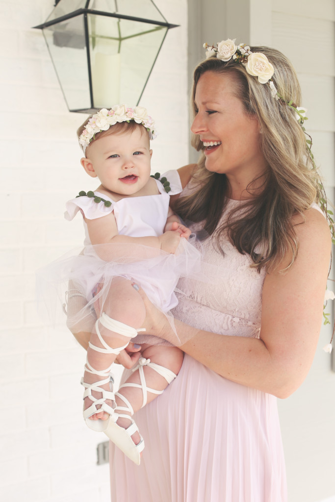 Lilyana's first birthday photoshoot and cake smash, featuring tutu romper with pompom trim from cuteheads