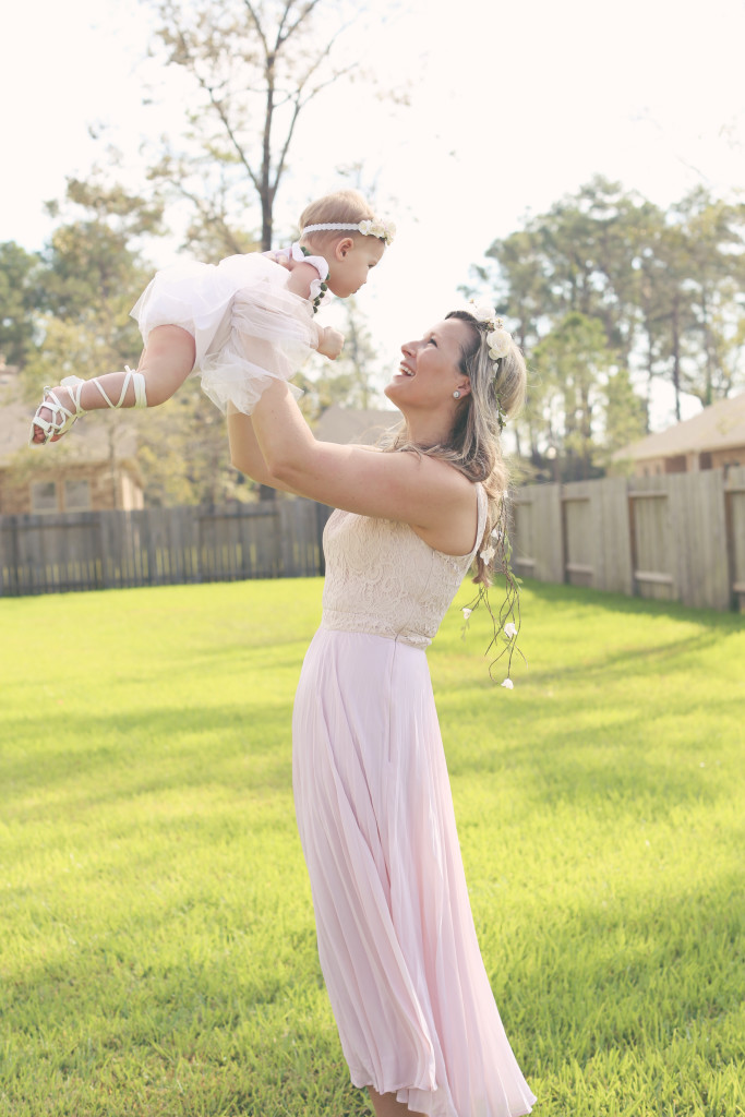 Lilyana's first birthday photoshoot and cake smash, featuring tutu romper with pompom trim from cuteheads