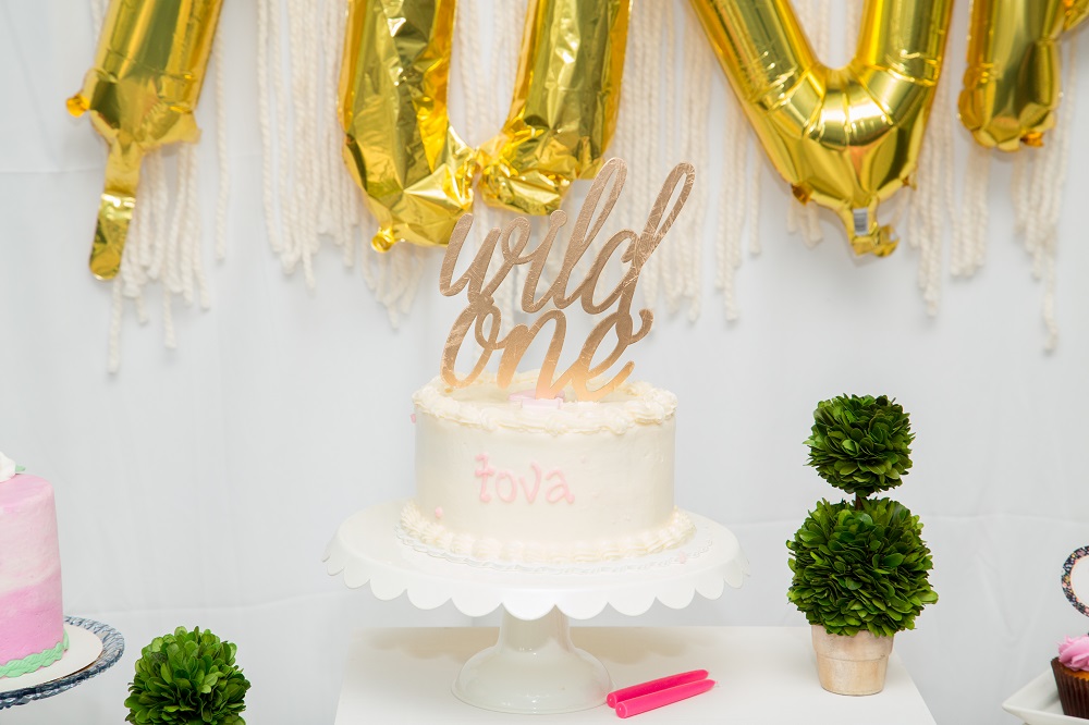 tovas first birthday secret garden party // wild one cake topper