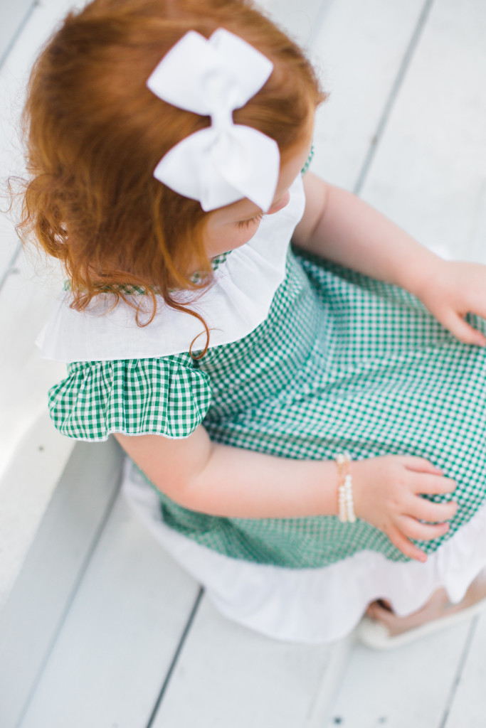 The cuteheads x Veronika's Blushing Harper dress, the cutest green gingham dress with white ruffled details, perfect for any season. Handmade girls fashion at its finest. 