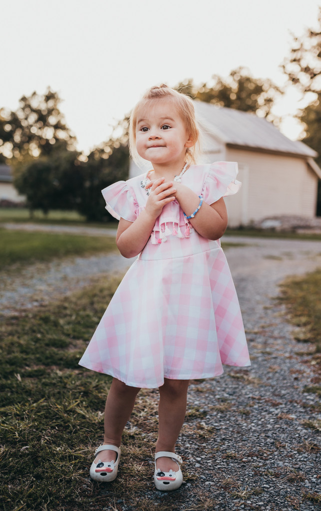 Pink and white buffalo plaid dress for girls. Only available at cuteheads.com.