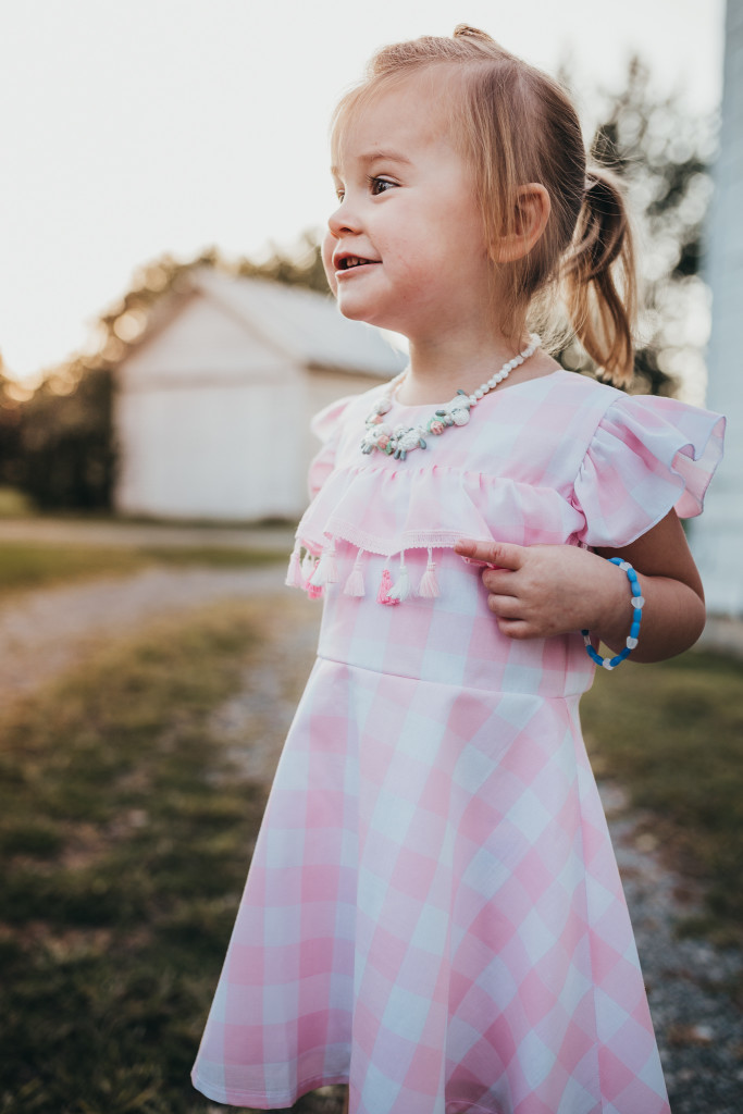 Pink and white buffalo plaid dress for girls. Only available at cuteheads.com.