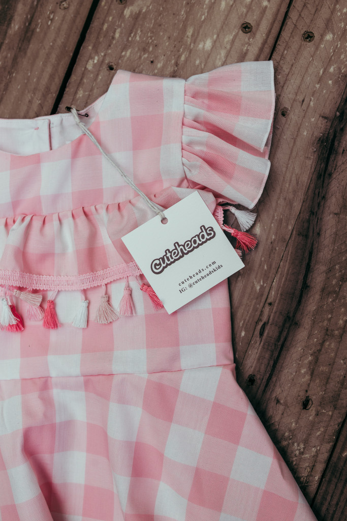 Pink and white buffalo plaid dress for girls. Only available at cuteheads.com.