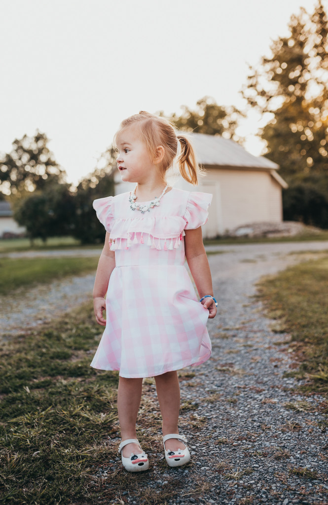 Pink and white buffalo plaid dress for girls. Only available at cuteheads.com.