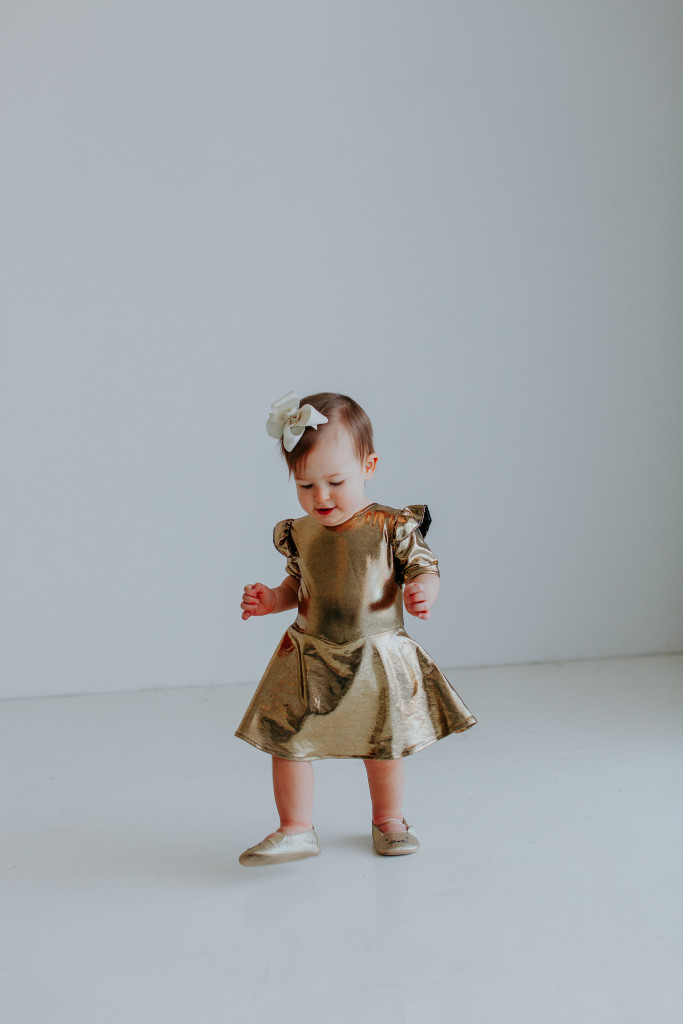 Our Favorite First Birthday Photoshoot Outfit Picks // gold twirly dress