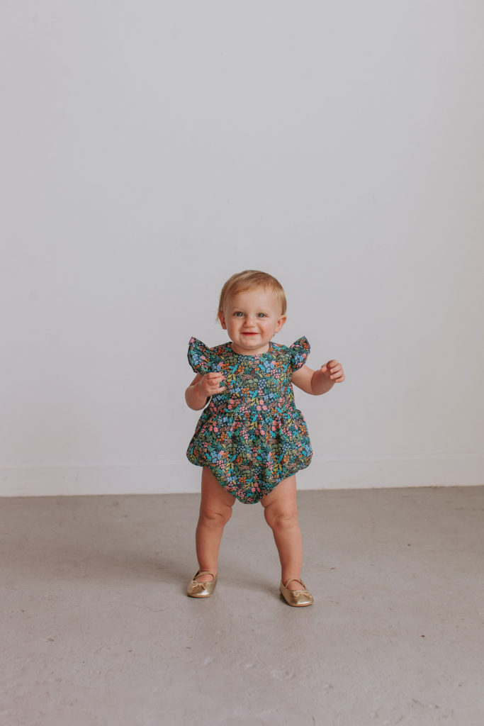 pink and navy floral Rifle Paper bubble romper