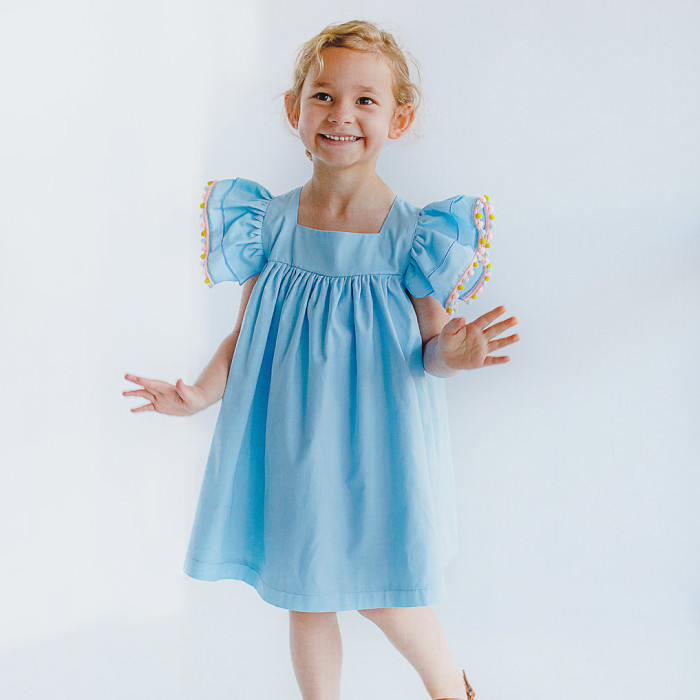 cuteheads Bella dress | blue cotton dress with pom pom trim flutter sleeves
